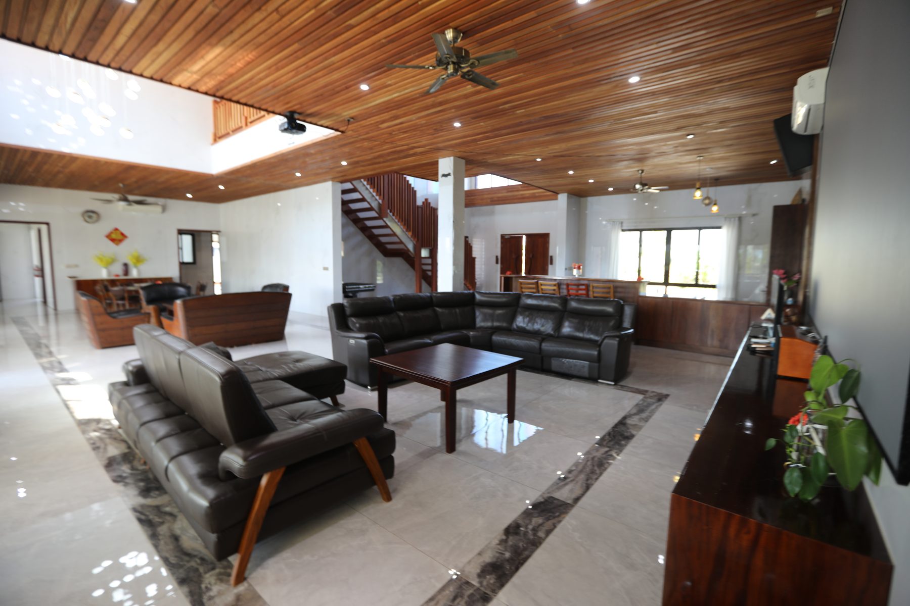 Home cinema area with projector screen and lounges