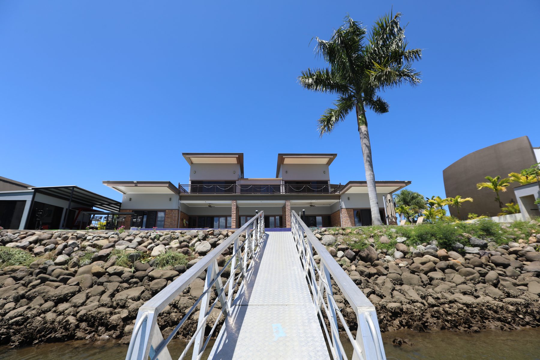 The dock at Villa 61 reaching out across the water