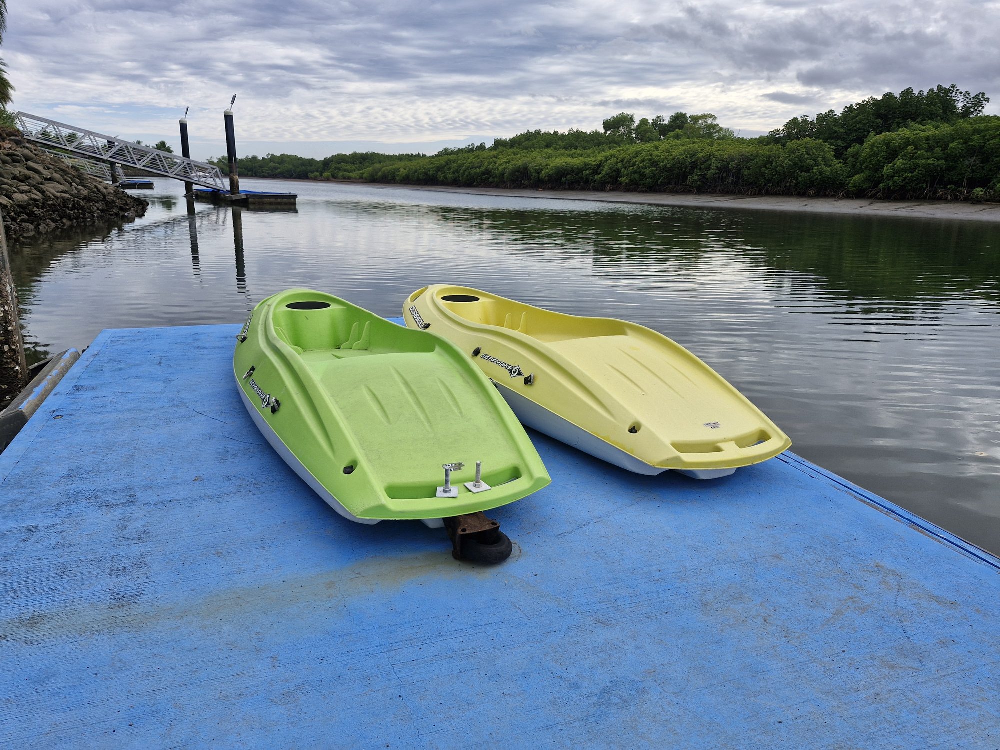 A pair of kayaks on the dock ready to launch
