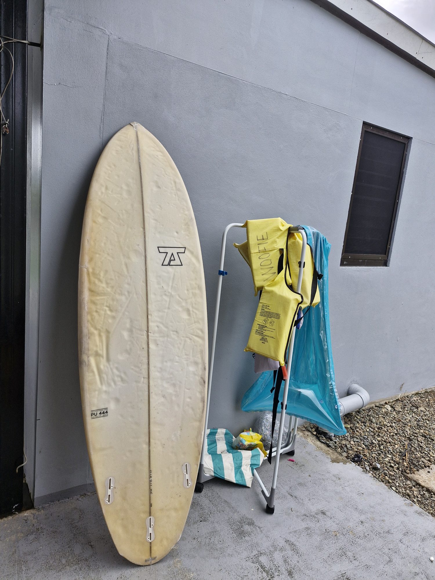 Surfboard and life jackets available for guests