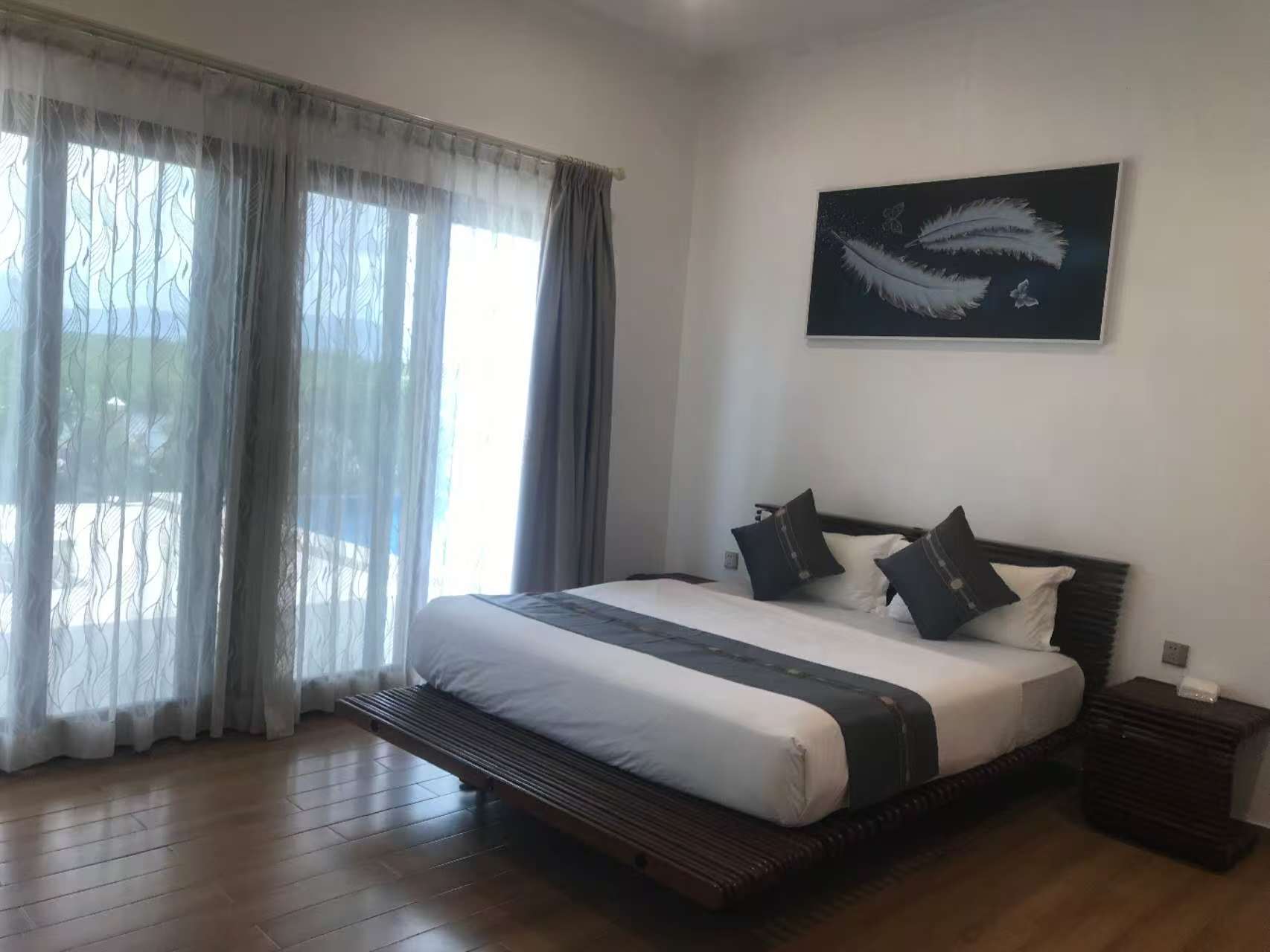 Bedroom 102 with king bed, desk and garden doors