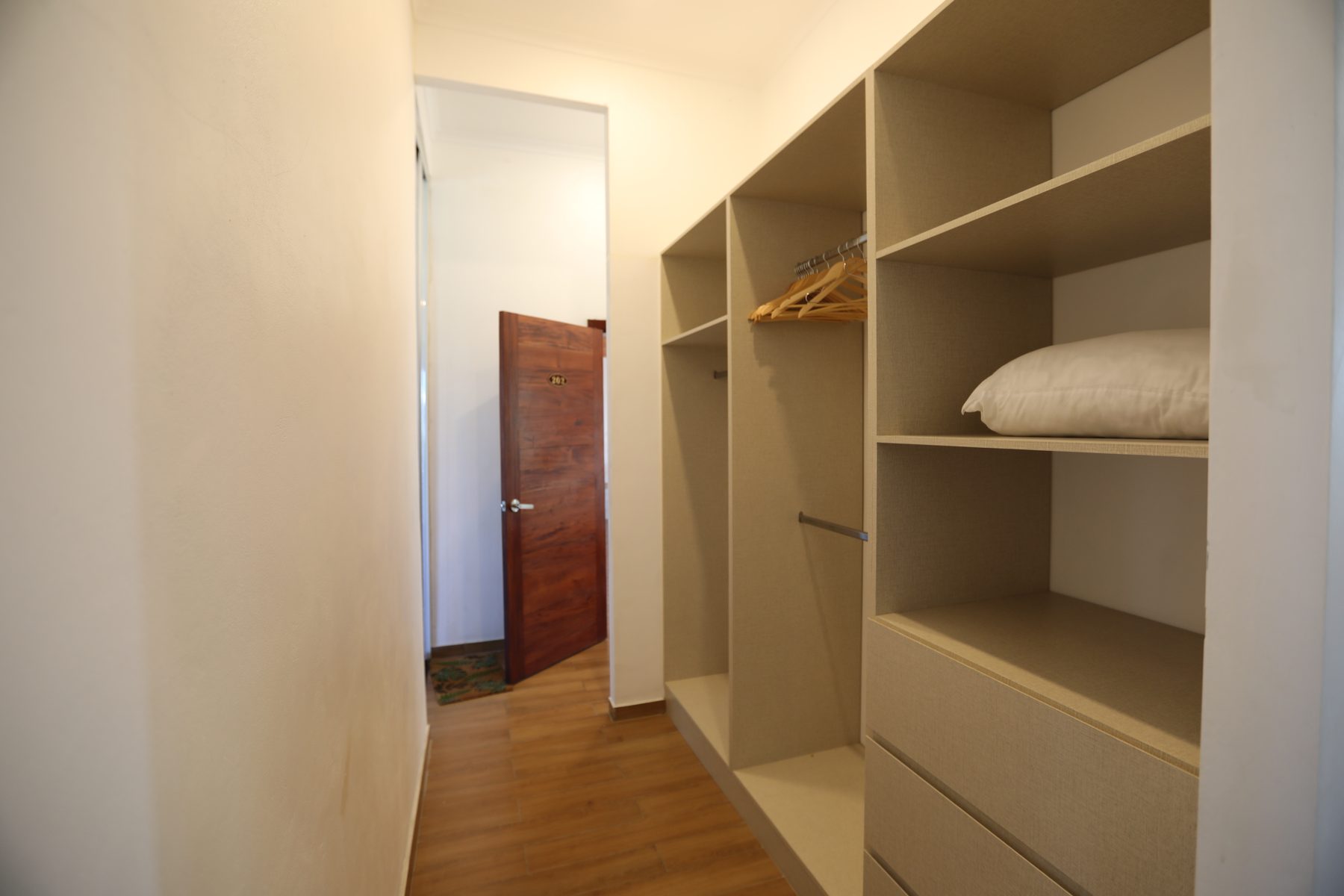 The walk-in wardrobe in Room 202