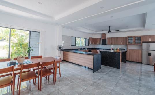 The ground-floor kitchen with island bench and full appliances