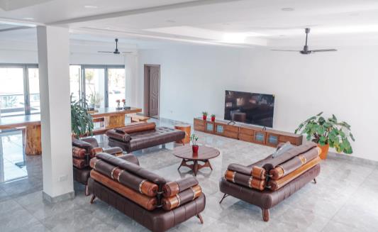Ground-floor living room with lounges and TV