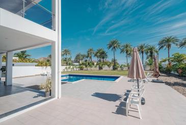 The covered patio where guests relax by the pool