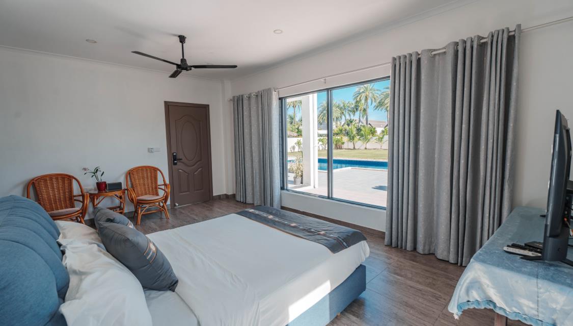 Bedroom 101 with pool-view doors