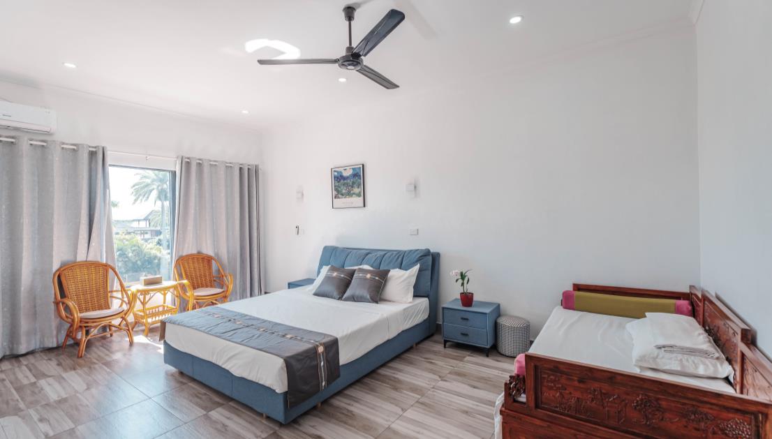 Bedroom 203 with king bed and an extra single bed